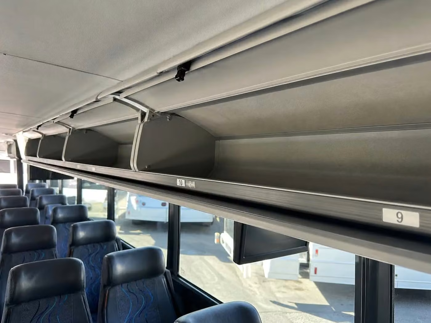 saratoga 56 passenger charter bus overhead storage